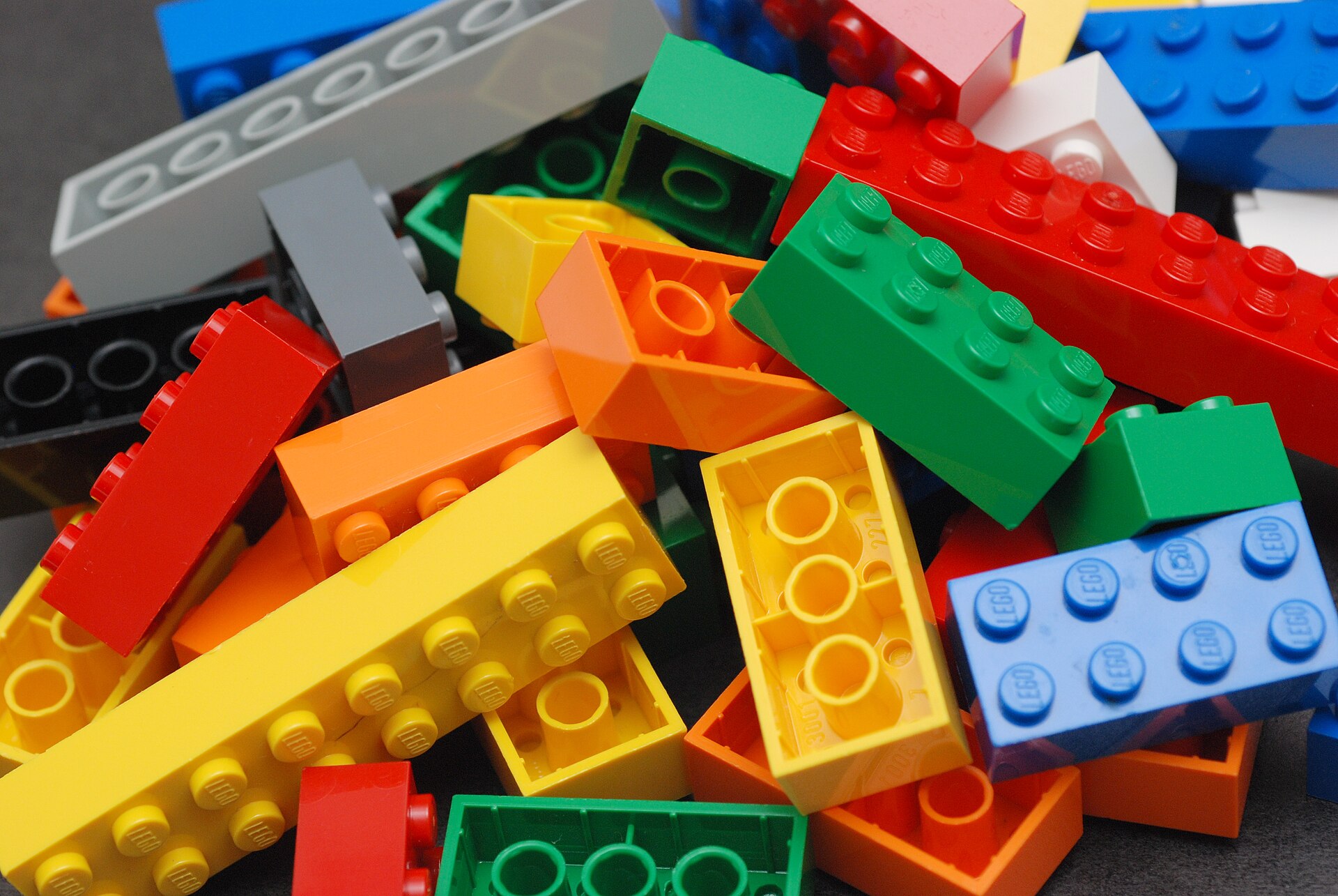 Sorted bags and trays of colourful bricks with a parts list